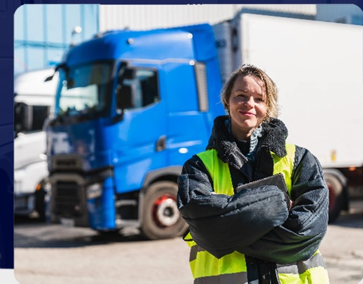 Transport Manager standing in front of goods vehicles