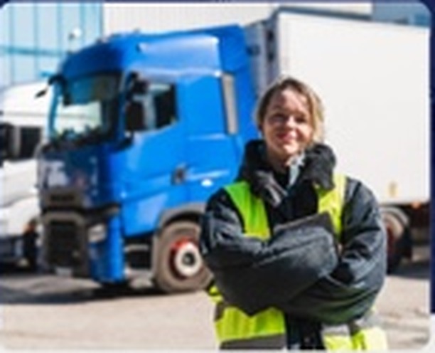 Transport professional in front of a goods vehicle
